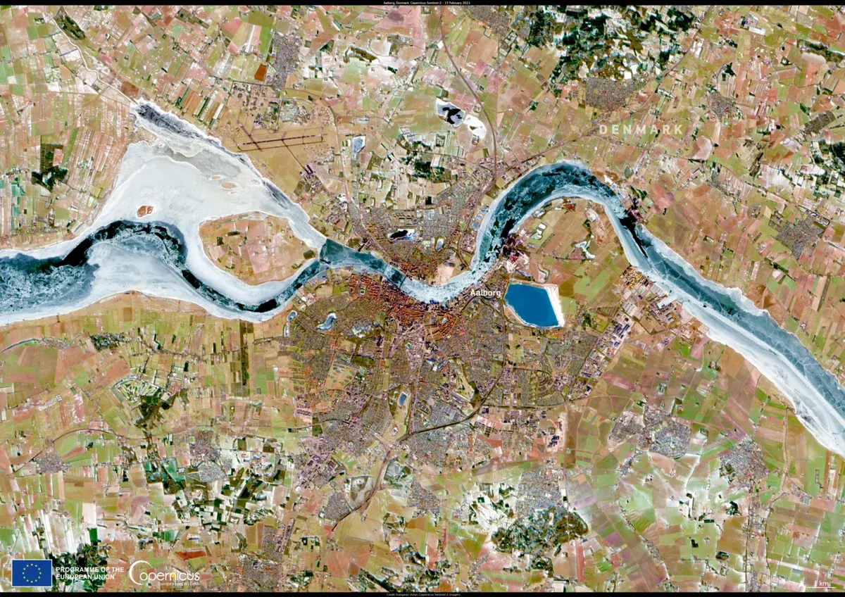 Satellite view of Aalborg, Denmark, with the Limfjord and surrounding farmland.